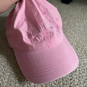 The 1975 pink baseball cap